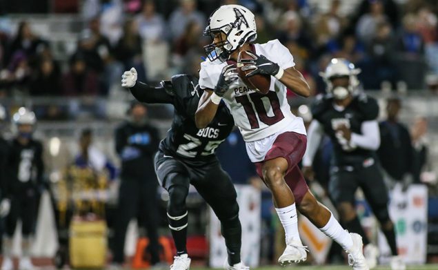 GREAT CATCH - Pearland junior wide receiver Cedric Mitchell (10) hauls in a pass against Brazoswood. The Oilers beat the Bucs 45-0 to secure their place in the playoffs. Pearland is now 7-2 overall and 4-2 in district. Pearland will hose George Ranch on Friday, November 8 at The Rig at 7:00 p.m. (Photo by Lloyd Hendricks)