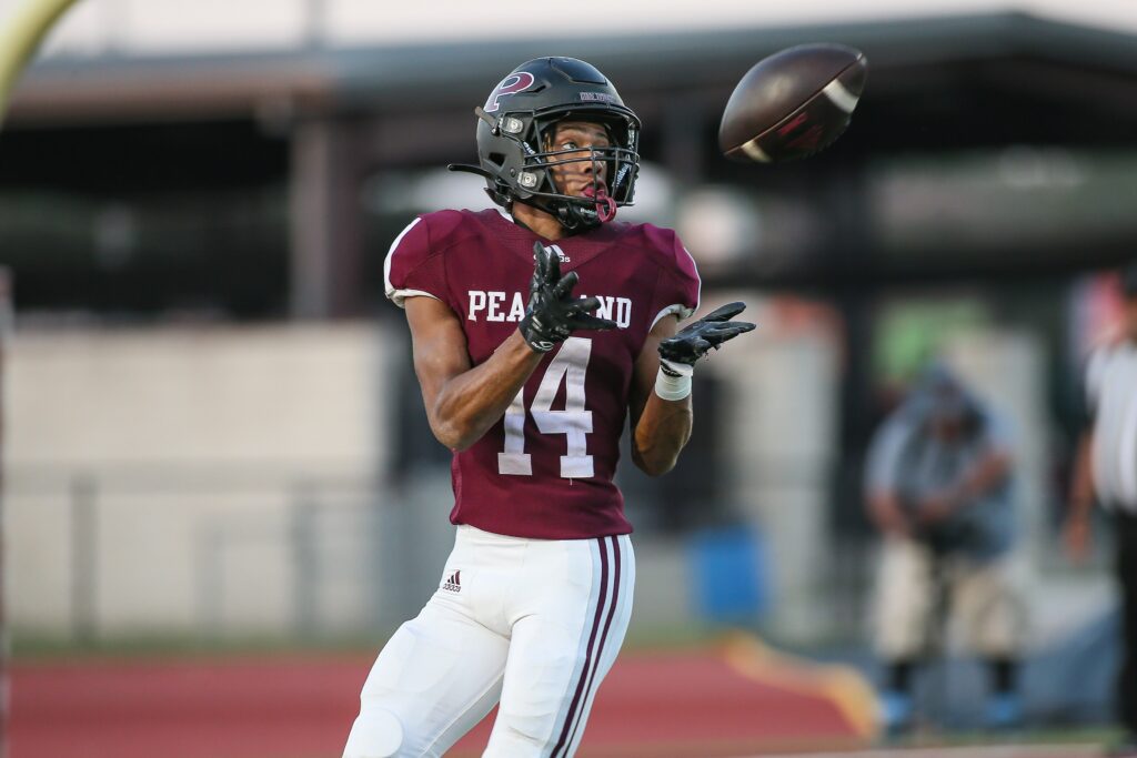 OUTSTANDING PERFORMANCE - Pearland senior wide receiver Christian Pitts catches a 31-yard touchdown pass on the first play of the game vs Shadow Creek. Pitts also started the game off with a 69-yard kickoff return to put the Oilers deep into Shadow Creek territory. Pearland would hold a 20-10 lead into the fourth quarter until the Sharks offense finally broke out with their trademark big plays for two late touchdowns to get the win 24-20. Up next for Pearland is a road trip to face Alief Elsik while Shadow Creek is at home for Alief Hastings. Both games are Friday September 30 at 7 p.m. (Photo by Lloyd Hendricks)