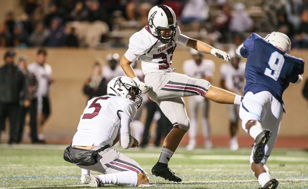 ON TARGET - Pearland junior placekicker Caleb Mendez (33) boots a 25-yard field goal against Alief Elsik. The young kicker also hit 8-of-8 extra points giving him 11 points. His holder is Layne Roblyer (5). The Oilers blistered the Rams 61-0. Pearland (5-1, 2-1) will host the Strake Jesuit Crusaders (4-2, 2-1) on Friday, October 18 at 7:00 p.m. at The Rig. It is also Homecoming for the Oilers. (Photo by Lloyd Hendricks)