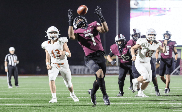 SCORING GRAB - Pearland QB Jake Sock tossed a 20-yard touchdown pass to Dylan Dixson for a 21-0 lead in the first quarter against the Alvin Yellowjackets.. The Oilers went on to a 48-9 district win to close out the regular season at 7-2. The Oilers punched their ticket to the Class 6A Region III Div. I playoffs for the 21st straight season. (Photo by Lloyd Hendricks)