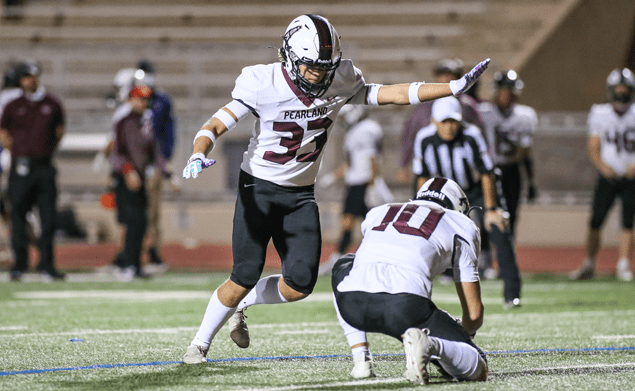 RIGHT ON TARGET -- Pearland senior placekicker Caleb Mendez (33) hits a 32-yard field goal against Alief Elsik as the Oilers beat the Rams 43-13 to improve to 4-1 on the season. The talented kicker also booted four PAT's to score seven of his team's 43 points. The hard-working Mendez is one of the more talented kickers in the Houston area. Isaac Sanchez (10) is the holder for Mendez. (Photo by Lloyd Hendricks)