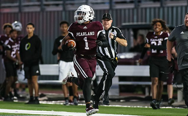 RECORD-SETTING RECEIVER - Pearland wide receiver Izeal Jones (1) catches a touchdown pass covering 83-yards on the opening possession for the Oilers against Strake Jesuit. Jones set a new PHS single-game mark for receiving yards of 212 yards on four catches and a pair of TDs. Jones caught another touchdown pass covering 55-yards from QB Jake Sock. The Oilers beat the Crusaders 41-20 in the district opener for both teams. (Photo by Lloyd Hendricks)