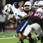 PEARLAND DEFENSE - Pearland limited Alief Elsik to only six points in the Oilers' 42-6 homecoming win. Ian Ejedepang-Koge (29) and Elijah Cavitt-Holbert (99) and others stopped wide receiver Adryan Brown (4) on this play. (Photo by Lloyd Hendricks)